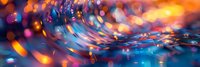 Colorful abstract water ripples with vibrant bokeh lights creating magical atmosphere. Macro photography of liquid surface with orange and blue reflections perfect for creative backgrounds.