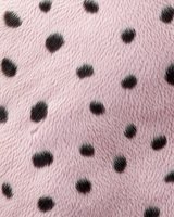 Soft pink faux fur texture with black polka dot pattern creates playful and feminine background. Seamless repeat design for fashion and textile projects.