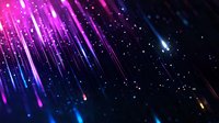 Vibrant pink and blue meteor shower against dark night sky with glowing particles and light streaks creating magical celestial atmosphere.