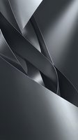 Abstract metallic silver and dark gray curved shapes with smooth reflective surfaces, creating a sleek futuristic composition for modern backgrounds.