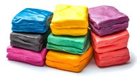 Colorful modeling clay blocks stacked in rows showing vibrant blue, yellow, pink, gray, green, red, and orange plasticine pieces on white background, isolated craft material.