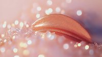 Metallic rose gold liquid lipstick swatch with glitter bokeh effect on pink background, close up macro cosmetic photography for beauty and makeup advertising.