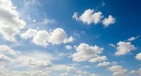 Dramatic blue sky with fluffy white cumulus clouds on sunny day. Natural cloudscape background for weather forecast, meteorology, climate concepts.