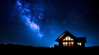 Cozy cabin glowing warmly under spectacular starry night sky with vibrant Milky Way galaxy stretching across deep blue cosmos for astronomy and travel concepts.