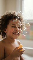 Happy mixed-race child with curly hair laughing while playing with soap bubbles in bright bathroom, holding yellow bubble wand during fun bath time.