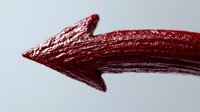 Red textured arrow pointing right with rough painted surface on white background for directional graphics and design projects.