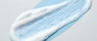 Blue and white cosmetic cream or gel texture smear isolated on transparent background for skincare and beauty product design applications.