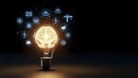 Glowing lightbulb with brain inside surrounded by floating technology icons on dark background representing innovation and smart solutions for business.