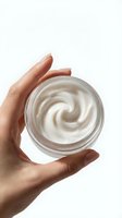 Hand holding open jar of white cream or moisturizer against white background, isolated for skincare, cosmetics, beauty product packaging, and wellness design use.
