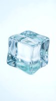 Single transparent ice cube with blue tint isolated on white background for beverage and cooling concepts in food photography and design projects.