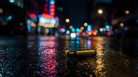 Wet urban street at night with colorful neon lights reflecting on rain-soaked pavement, creating bokeh effect for city atmosphere and nightlife concepts.