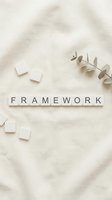 Framework word spelled with wooden letter tiles on neutral textured background with eucalyptus branch and scattered blocks for business concepts.