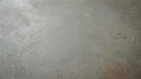 Polished concrete floor surface with natural texture and subtle variations for modern interior design and architectural backgrounds.