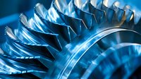 Macro view of industrial turbine blades in metallic blue tones showing precise engineering detail and curved surfaces with dramatic lighting effects for technology concepts.