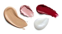 Cosmetic makeup smears collection featuring foundation, lipstick and cream textures isolated on white background for beauty product design.