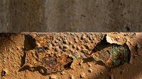 Weathered terracotta clay surface with deep cracks, peeling paint, and aged texture. Suitable for backgrounds, grunge overlays, and rustic design projects.