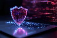 Digital shield glowing with blue and pink neon light on laptop keyboard against dark background with binary code streams, representing cybersecurity protection.