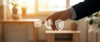 Businessman hand touching digital security icons representing cybersecurity, data protection and privacy solutions in modern office environment.