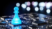 Glowing blue chess pawn piece on computer circuit board with bokeh lights representing AI strategy, digital transformation and tech innovation concepts.