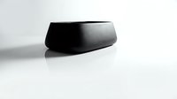 Minimalist matte black bowl on white background, modern design with smooth curves and subtle reflection, isolated for product presentation.