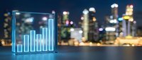 Neon glowing bar chart hologram displaying upward financial growth data with blurred city skyline and water reflection at night for business analytics.