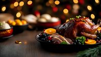 Roasted turkey garnished with cranberries, citrus and herbs on dark wooden table with festive bokeh lights background, holiday dinner celebration.