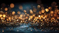 Golden bokeh lights floating above sparkling blue glitter surface creating magical atmosphere for luxury backgrounds and festive celebrations.