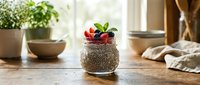 Succulent plant with red flowers in textured pot on wooden table near window, surrounded by potted plants and home decor accessories.