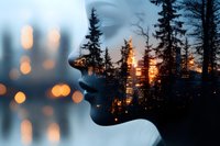 Double exposure silhouette of woman's face blending with sunset forest landscape, pine trees and bokeh lights creating dreamy atmospheric scene.