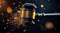 Dramatic wooden judge gavel shattering into golden particles with glowing bokeh effect on dark background, symbolizing justice system transformation and legal power.