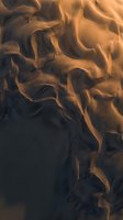 Dramatic golden flames dancing upward against dark background creating dynamic fire patterns for energy and power concepts.