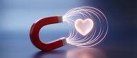 Red horseshoe magnet attracting glowing pink heart with energy waves on gradient background for love attraction and relationship concepts.