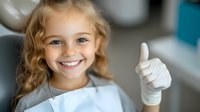 Young girl with blonde curly hair wearing medical gloves shows thumbs up with bright smile, representing healthcare safety and hygiene practices for children.
