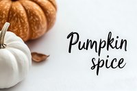 Orange and white pumpkins with pumpkin spice text on white background, seasonal autumn food concept for recipes and marketing.
