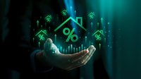 Businessman holding holographic house with percentage symbols representing mortgage rates, real estate investment and property financing concepts.