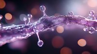 Mesmerizing water splash with droplets frozen in motion against purple and orange bokeh background, creating magical macro photography effect.