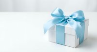 White gift box with elegant blue satin ribbon and bow on clean background for celebrations, holidays, birthdays, and special occasions.