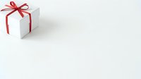 White gift box with red ribbon bow on neutral background, suitable for holiday, birthday, and celebration marketing materials.