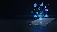 Digital technology icons emerging from tablet screen with glowing blue effects on dark background for business presentations and tech concepts.