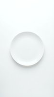 Empty white ceramic plate on clean white background for food photography and kitchen design projects.