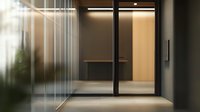 Modern minimalist office entrance with glass doors, wooden accent wall and soft ambient lighting creates professional atmosphere for business interior design.