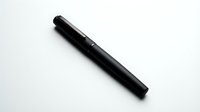 Black fountain pen with cap on white background, isolated writing instrument for stationery and office design projects.