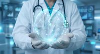 Doctor holding glowing digital heart with medical technology interface in modern healthcare facility representing cardiology innovation and futuristic medicine.