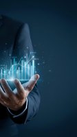 Businessman in dark suit holding glowing financial charts and upward trending arrow graph with data numbers on blue background for business growth and investment analysis.