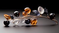 Elegant branch brooch with amber, clear and black crystal spheres and leaves on metallic stem against dark background, luxury jewelry design concept.