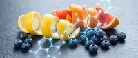 Fresh citrus fruits and blueberries arranged on dark slate surface with geometric light overlay pattern for healthy eating and nutrition concepts.