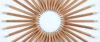 Wooden pencils arranged in perfect circle pattern on white background, isolated design element for creative projects and educational materials.