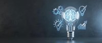 Glowing brain lightbulb with innovation icons on dark background representing creative thinking, artificial intelligence and business strategy solutions.
