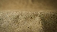 Close-up macro view of natural burlap fabric texture showing detailed weave pattern and fibers for rustic design projects and organic material backgrounds.