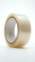Clear adhesive tape roll with transparent packaging material on white background, suitable for shipping, storage, and office supplies applications.